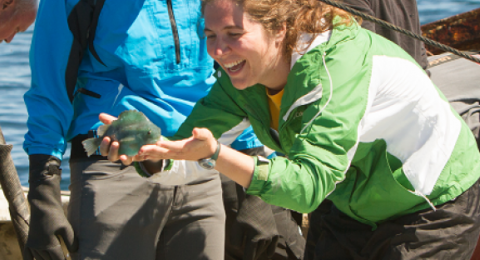 student holding a sunfish