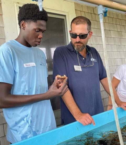 student and teach at sea tables with specimen