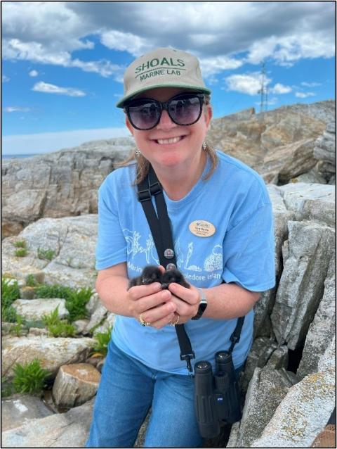 Sara Morris holding a BLGU chick
