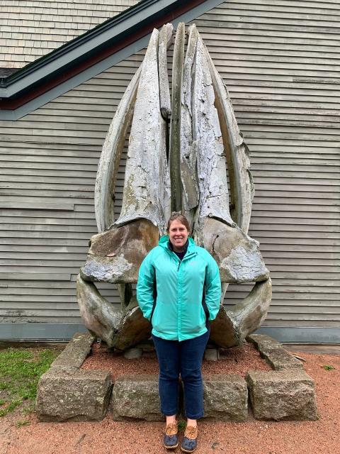 Nadine in front of a whale skull