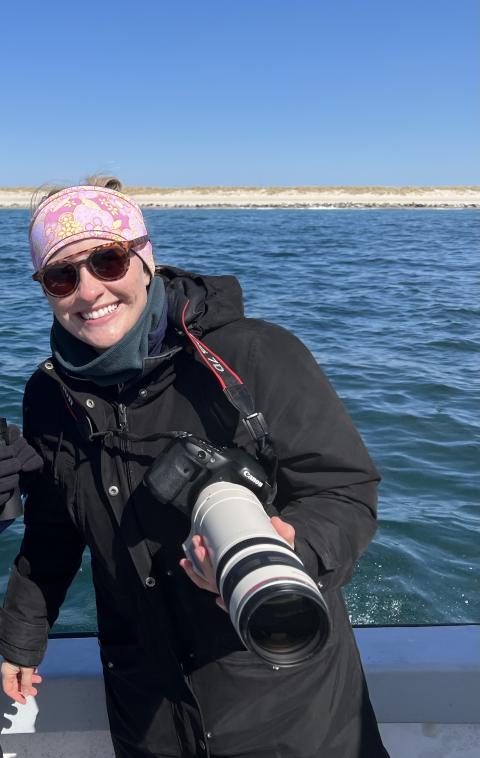 woman on boat with camera