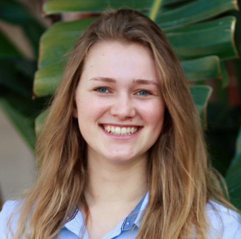 blond woman with blue shirt, smiling