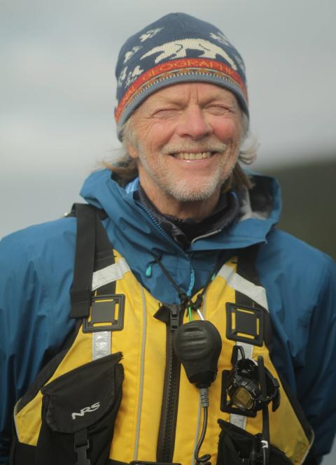 man with weathered face, hat, smile